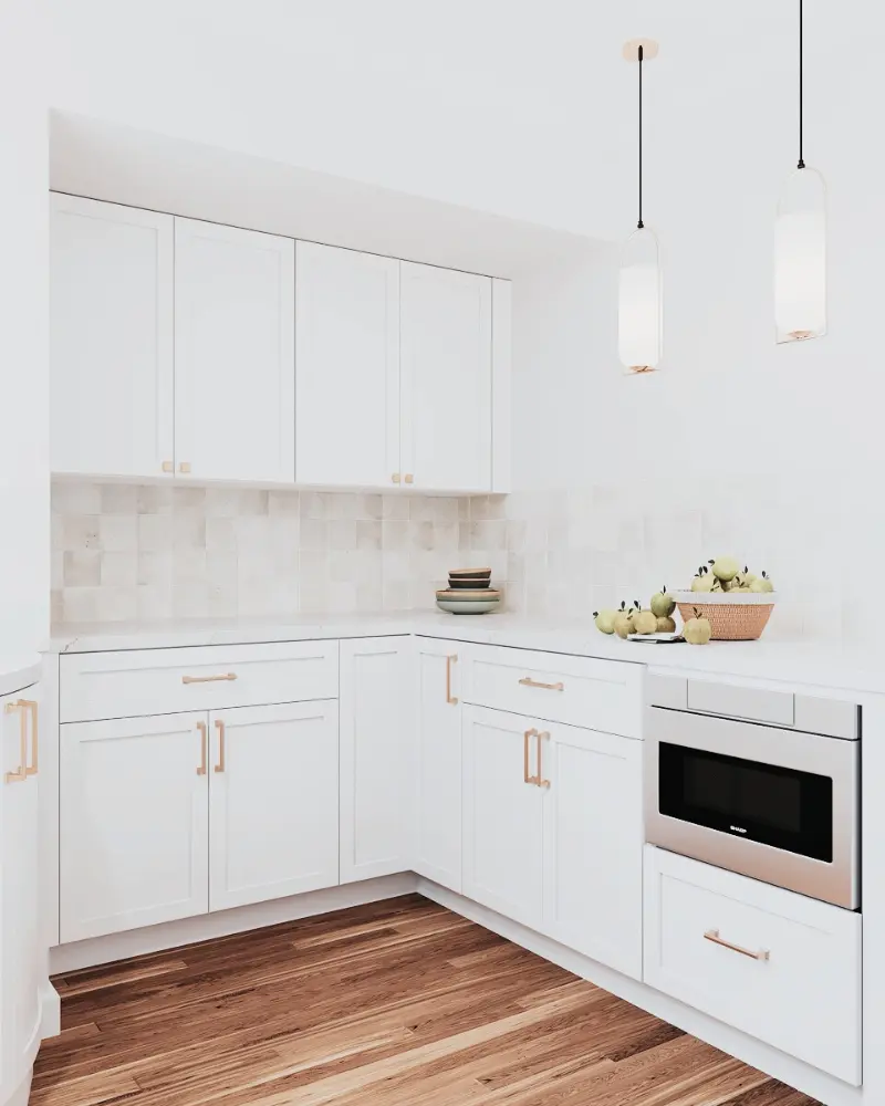 Custom kitchen remodel featuring pendant lighting, white cabinetry, and warm wood flooring in a Bay Area home