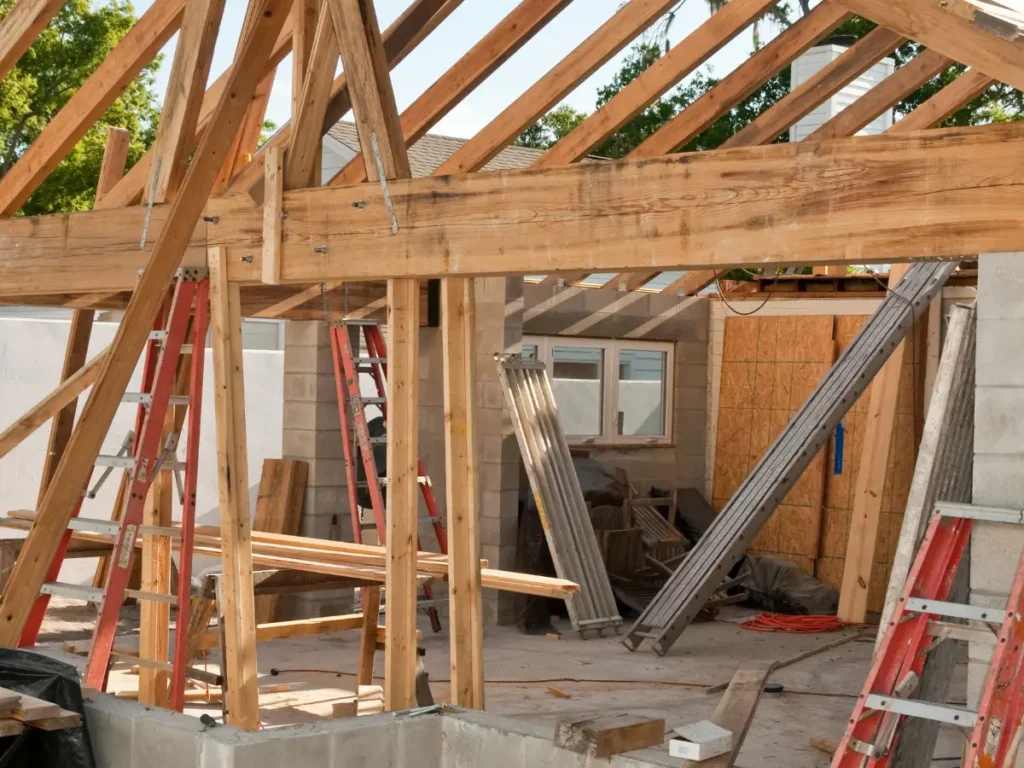 Residential home addition framing with exposed structural beams and roof integration typical of Bay Area remodels