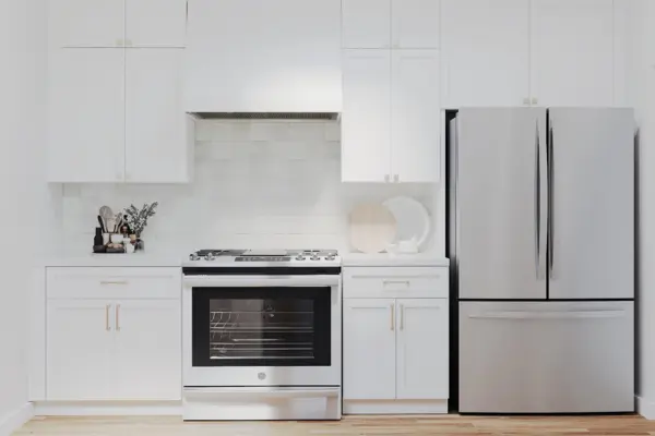 Modern kitchen remodel with white shaker cabinets, stainless steel appliances, and custom storage in a Bay Area home