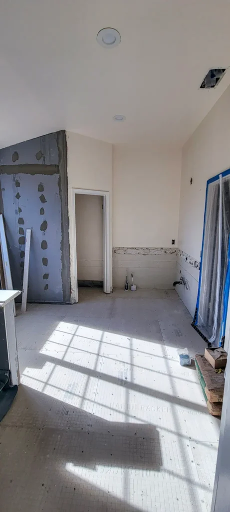 Bathroom remodel construction phase in Pleasanton, CA showing demolition and structural preparation