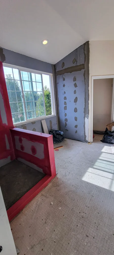 Shower waterproofing and wall preparation during bathroom remodel in Pleasanton, CA