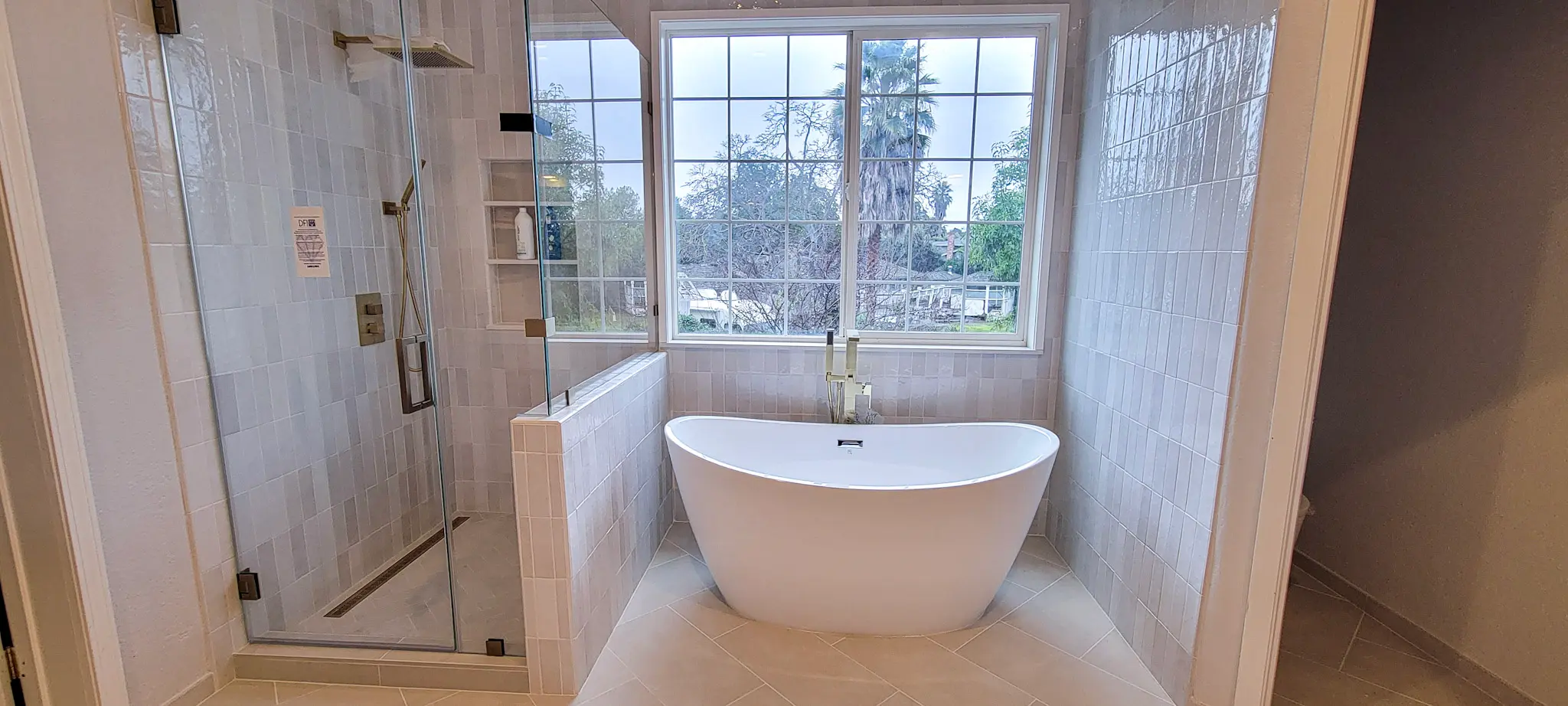 Luxury master bathroom remodel in Pleasanton, CA with freestanding tub and frameless glass shower