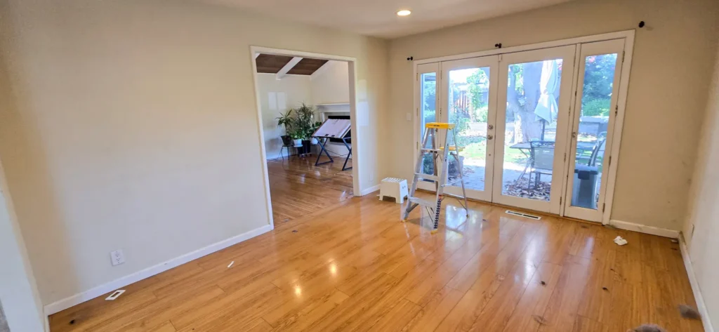 Before photo of Santa Clara home prior to open concept remodel showing original room layout and hardwood flooring