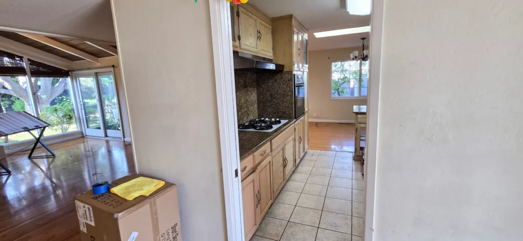 Before photo of narrow galley kitchen layout in Santa Clara prior to full kitchen relocation and remodel