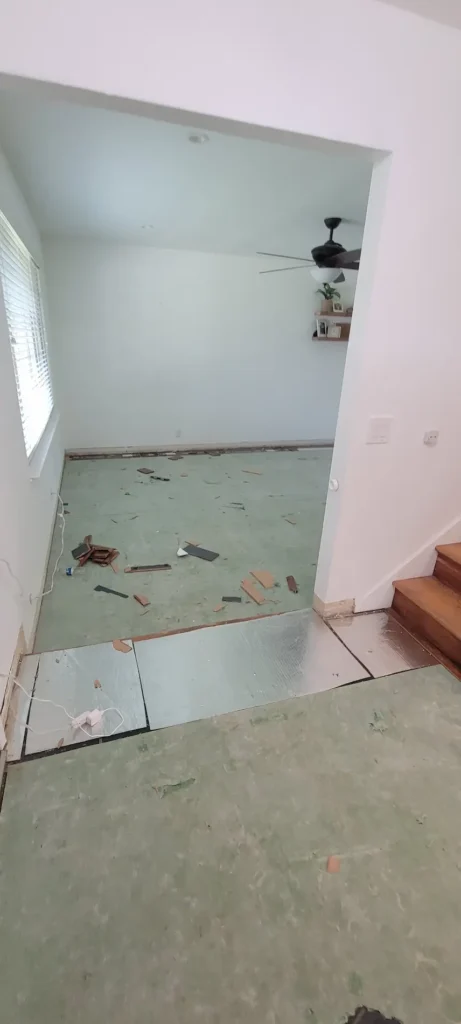 Concord CA living room flooring removal during remodel with subfloor exposed