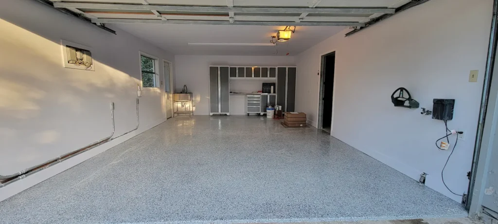 Finished garage remodel with epoxy flake flooring installed in El Sereno California