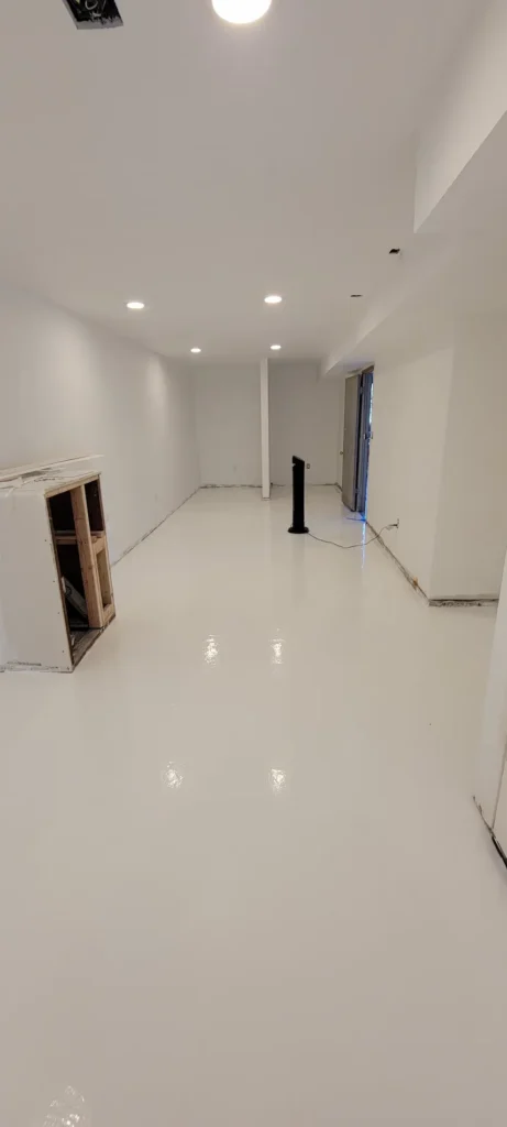 Fresh epoxy flooring being installed in garage and laundry room remodel in El Sereno California