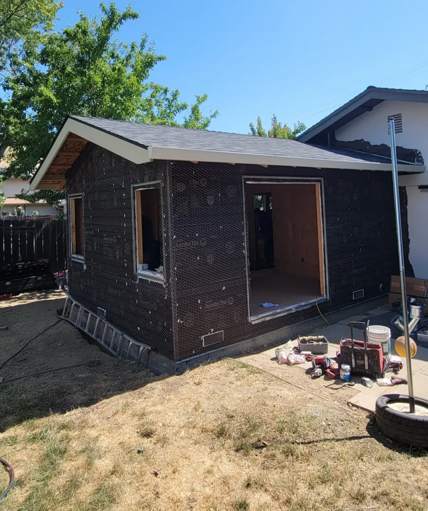 Exterior construction of a master suite home addition in Martinez California showing new bedroom and bathroom expansion by Lions Gate Remodeling