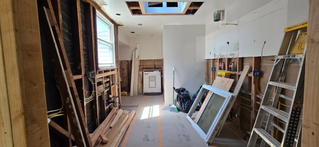 Walnut Creek kitchen remodel during demolition with exposed framing and skylight opening being prepared