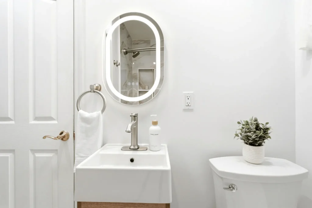 Floating oak vanity with integrated sink in a contemporary bathroom.