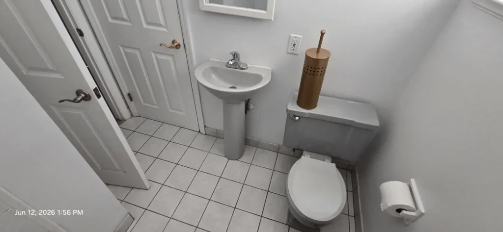 Builder-grade hall bathroom before renovation in a Moraga home.